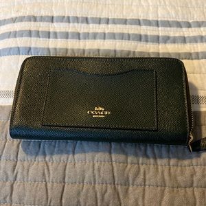 Black leather Coach zippered wallet. Great condition.